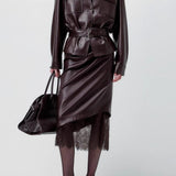 Elegant lædernederdel udsmykket med blonder