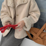 Vendbar pelsfrakke med bløde reverser