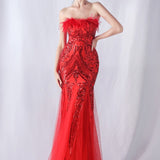 Aftenkjole med pailletter og strudsefjer