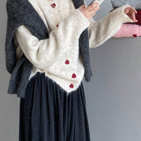 Oversized cardigan med hjerteformede knapper og rund hals