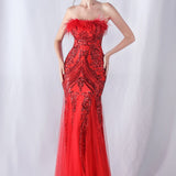 Aftenkjole med pailletter og strudsefjer