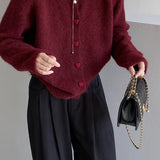 Oversized cardigan med hjerteformede knapper og rund hals