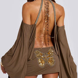 Bodycon minikjole med åben ryg, flagermusærmer og kæde