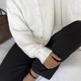 Vintage lysegrå strikvest med muslingeknapper