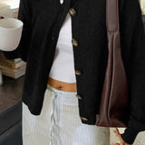 Minimalistisk cardigan med lange ærmer og knapper