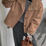 Vendbar pelsfrakke med bløde reverser