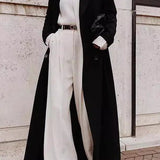 Lang frakke i ensfarvet uldblanding