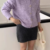 Løs og blød cardigan i ensfarvet strik