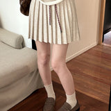 Plisseret mini-nederdel i strik