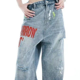 Brede jeans med falmet broderi