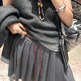 Plisseret mini-nederdel i strik