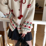 Oversized vest med pomponer