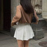 Højtaljet hvid plisseret mini-nederdel