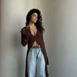 Langærmet strandvest med svaj i strik