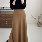 Vintage højtaljet maxinederdel i tekstureret strik