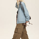 Vendbar jakke med opretstående krave og farveblokke