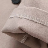 Kort dobbeltradet uldjakke