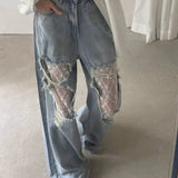 Rippede jeans med blondepaneler