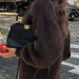 Minimalistisk cardigan med lange ærmer og knapper