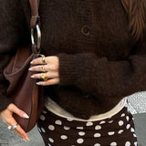 Minimalistisk cardigan med lange ærmer og knapper