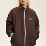 Vendbar jakke med opretstående krave og farveblokke