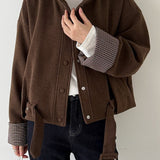 Uldfrakke med opretstående krave og ternede paneler, korte manchetter