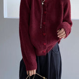Oversized cardigan med hjerteformede knapper og rund hals