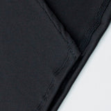 Rygløs aftenkjole med bindedetalje og høj slids