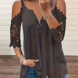 Lotte - Bluse med lynlåslukning og usædvanlige skuldre