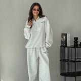 Todelt sæt: hættetrøje med print og halv lynlås og bukser med vide ben og lige ben