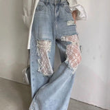 Rippede jeans med blondepaneler