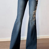 Vintage bootcut jeans med plantebroderi