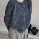 Oversized cardigan med hjerteformede knapper og rund hals