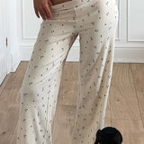 Todelt sæt: ærmeløs crop top med blomsterprint og bukser med vide ben og blomsterprint