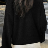 Minimalistisk cardigan med lange ærmer og knapper