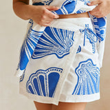 Ærmeløs, løstsiddende bandeau-nederdel med print