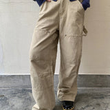 Cargojeans med lige ben og dekonstruerede paneler