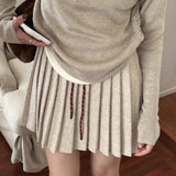 Plisseret mini-nederdel i strik