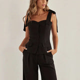 Todelt, smalt ærmeløst kontorsæt i sort bomuld