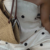 Todelt sæt til kontoret: prikket tubetop og bukser med vide ben