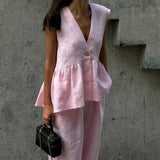 Todelt løstsiddende lyserødt bomulds- og hørsæt til kontoret