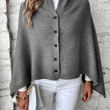 Dameponcho – Blød strik – Løs pasform – Knaplukning – Ribbet finish