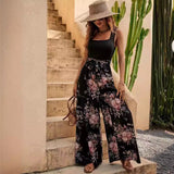 Damejumpsuit – Ærmeløs – Blomsterprint – Bælte i taljen – Vide ben