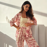 Damesæt i to dele – Afslappet pasform – 3/4-længde åben top – Blomstrede lange bukser