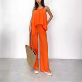 Damesæt: Flagrende asymmetrisk top uden ryg – Højtaljede bukser med vide ben