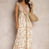 Damejumpsuit – Ærmeløs – V-hals – Bindebånd i taljen – Flagrende printet snit