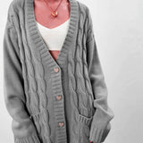 Damecardigan – Oversized pasform – Grov strik – Kabelstrik – Hjerteknapper – Lommer