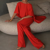 Damesæt i to dele – Flagrende asymmetrisk top – Elegante bukser med vide ben