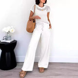 Damesæt – Kortærmet meshtop – Flagrende bukser med vide ben