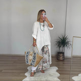 Dametunika – Løs pasform – Åndbar bomuld – Lange ærmer – Asymmetrisk kant